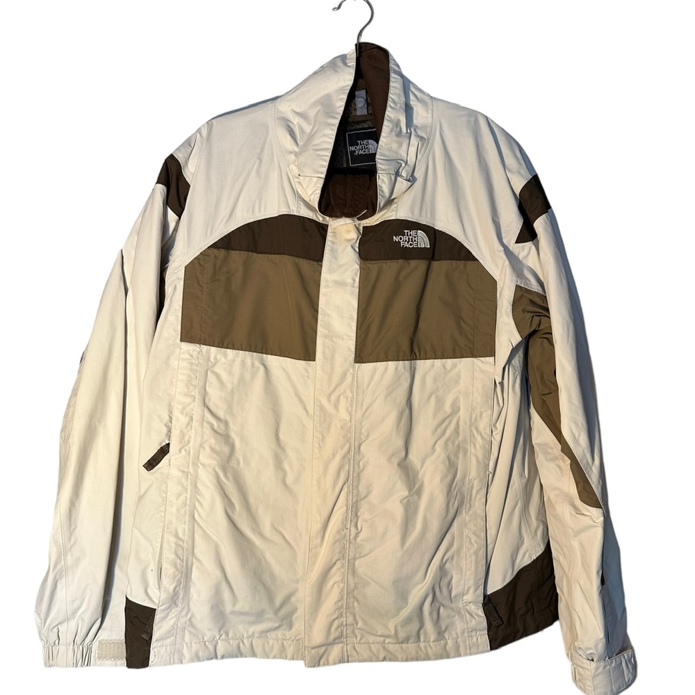 Brown and white Northface coat